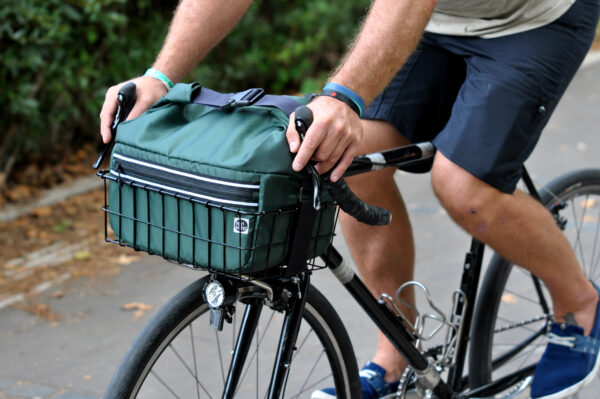 roll-top basket bag on a bike